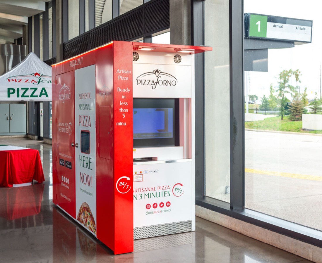 An automated pizza oven in an airport terminal